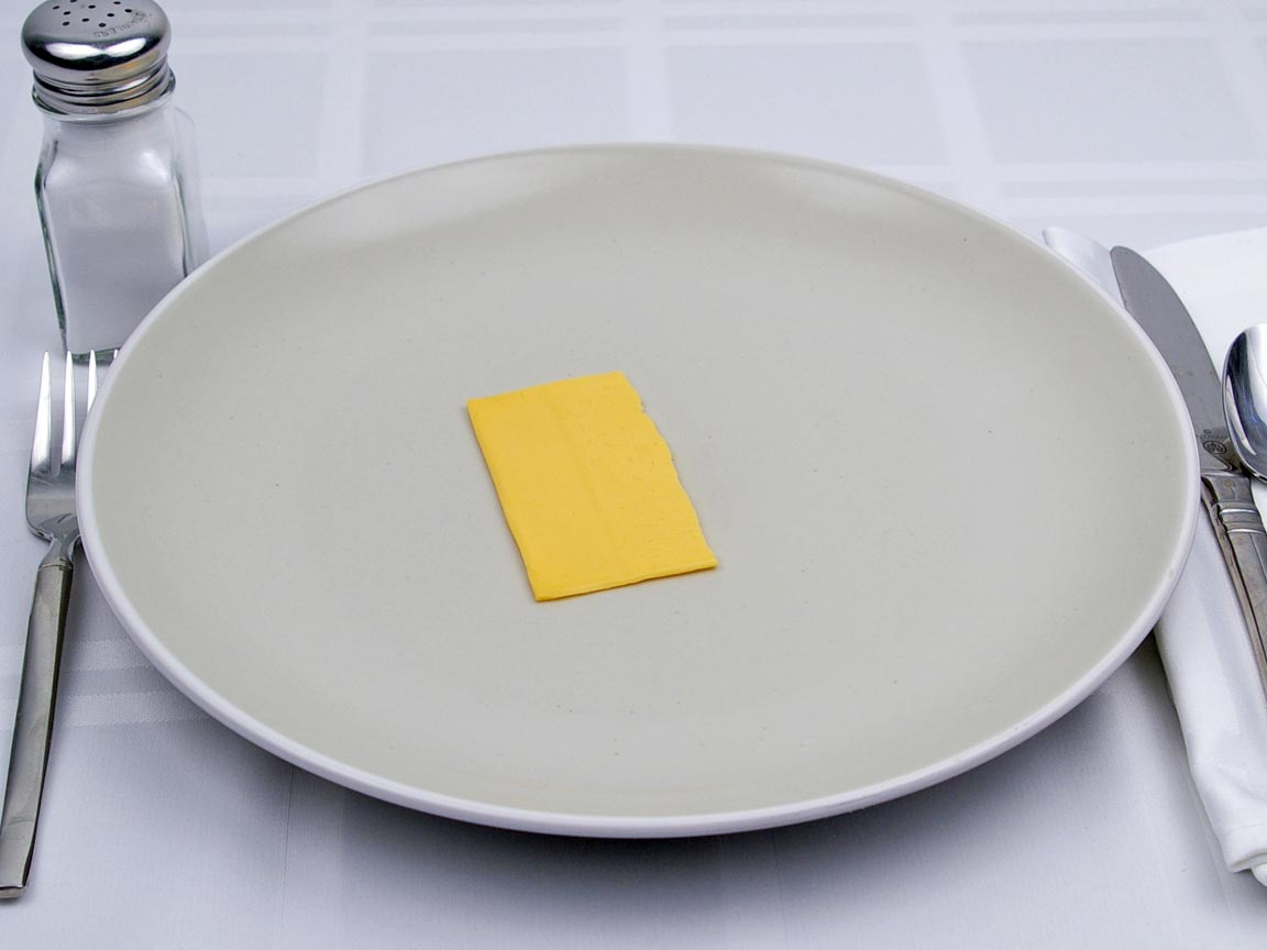 Calories in 0.5 slice of American Cheese - Fat Free Singles