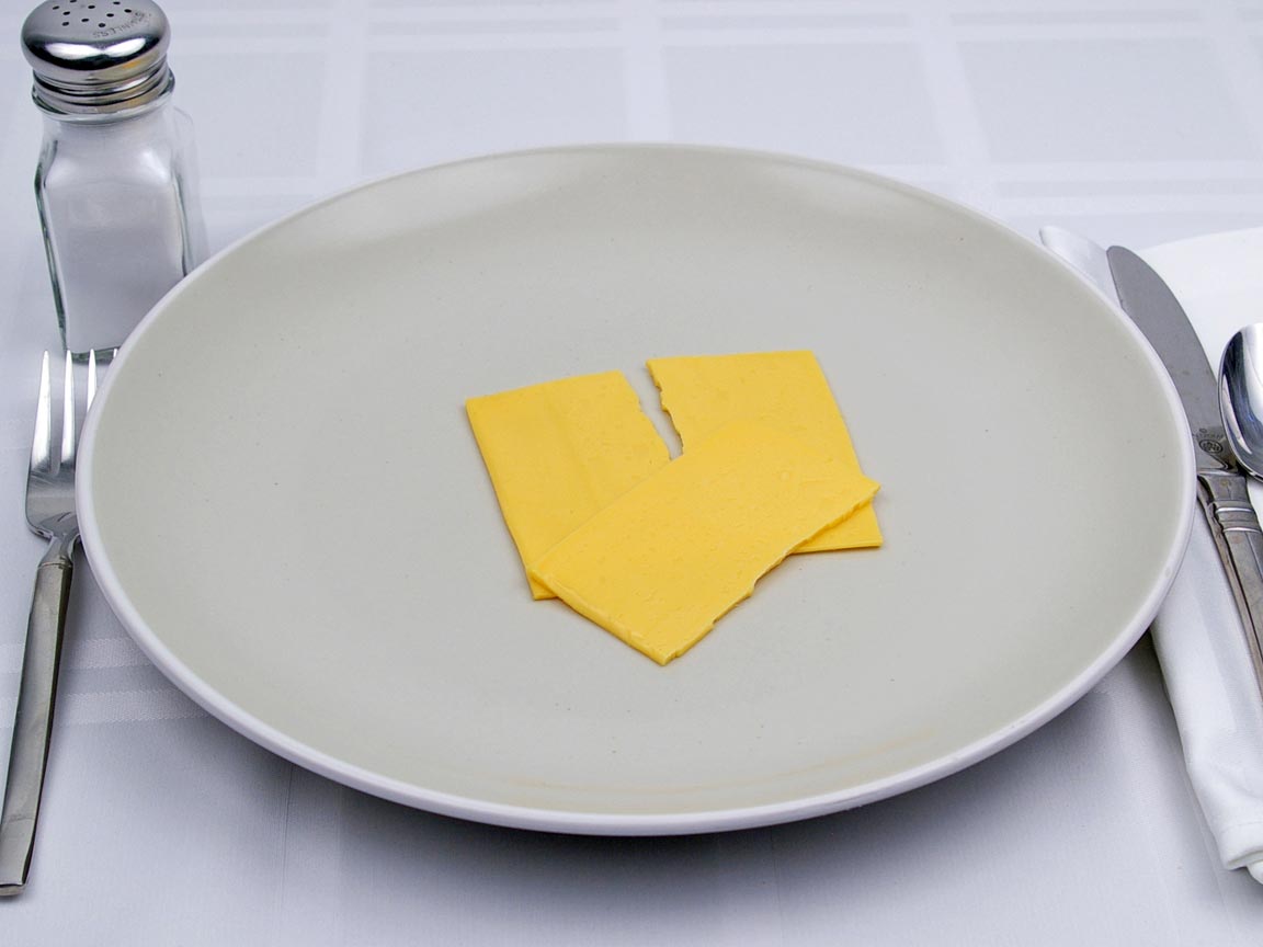 Calories in 1.5 slice of American Cheese - Fat Free Singles