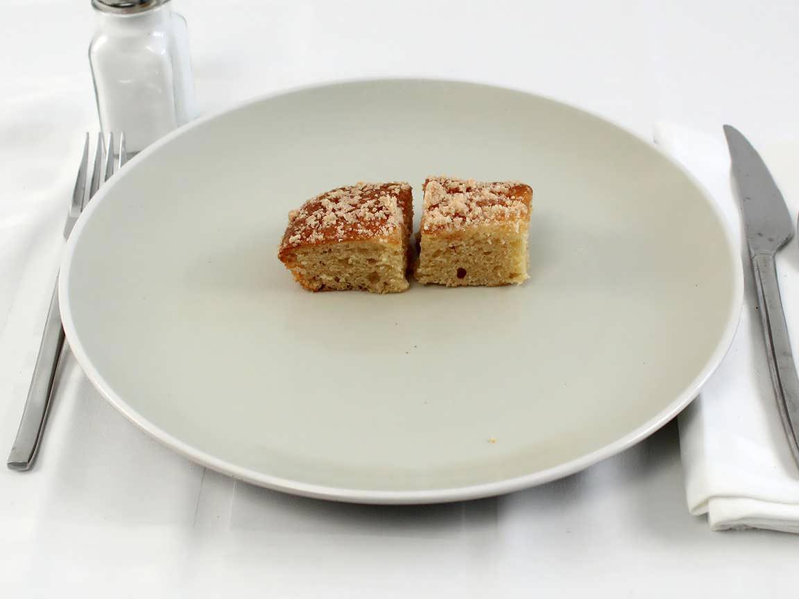 Calories in 0.5 piece(s) of Apple Coffee Cake