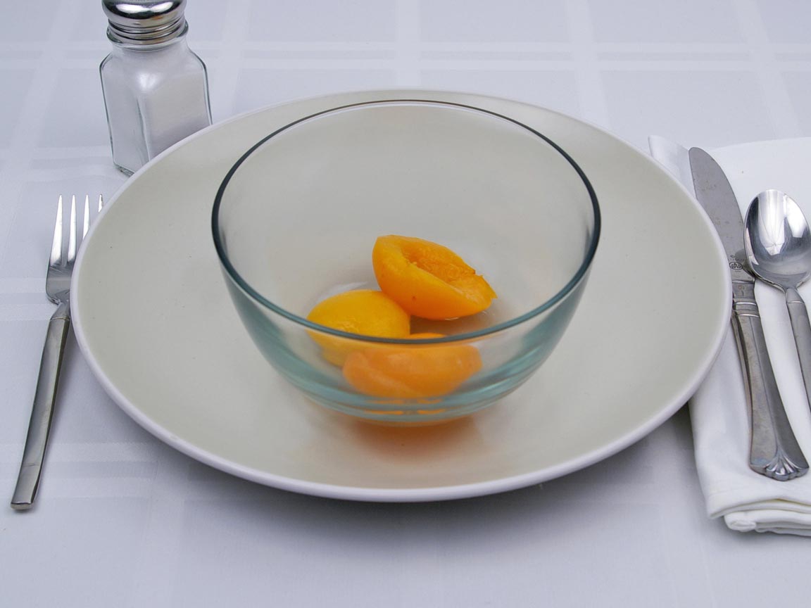 Calories in 0.49 cup(s) of Apricots in Heavy Syrup