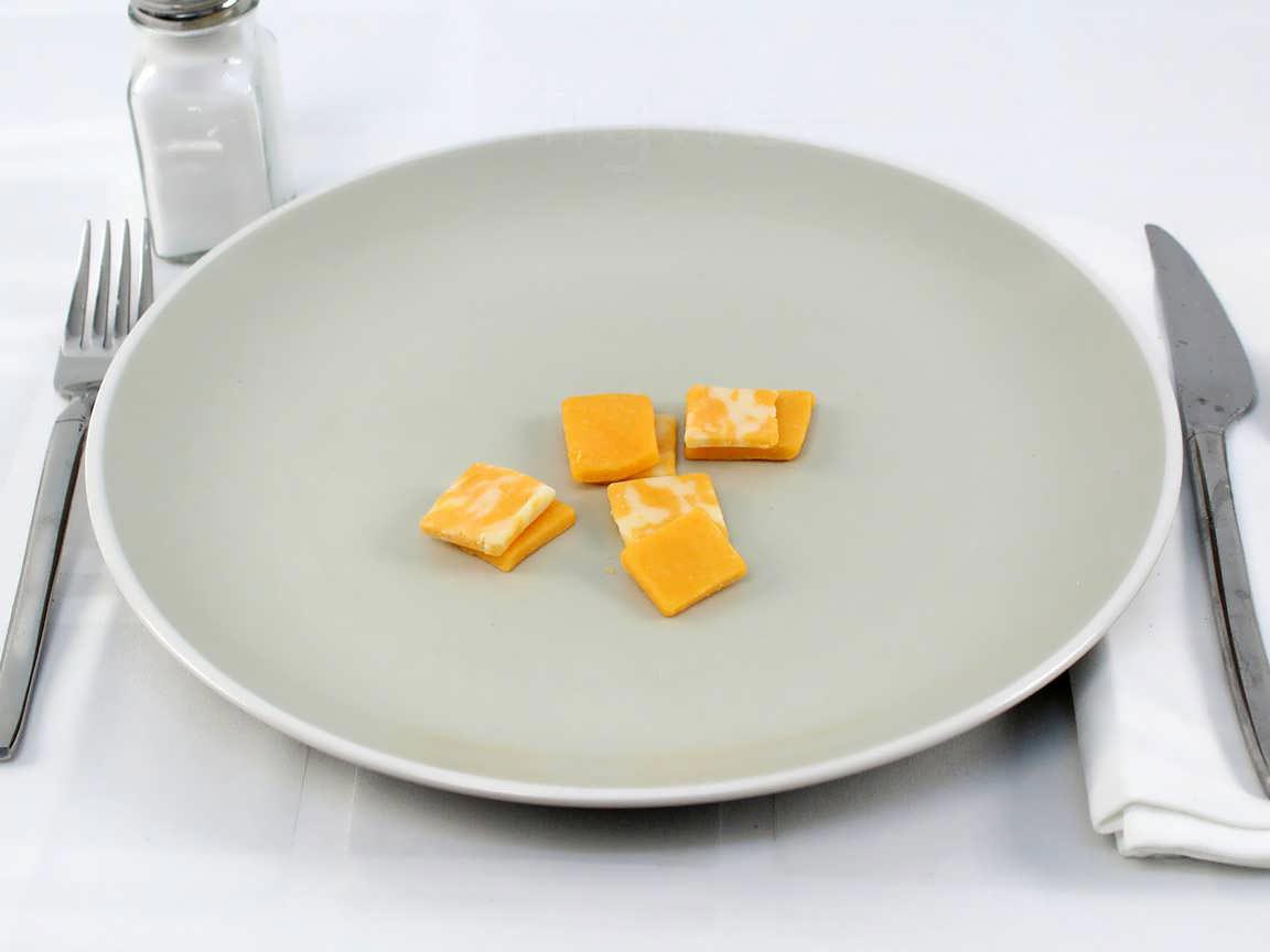 Calories in 24 grams of Cheddar Cheese Pieces