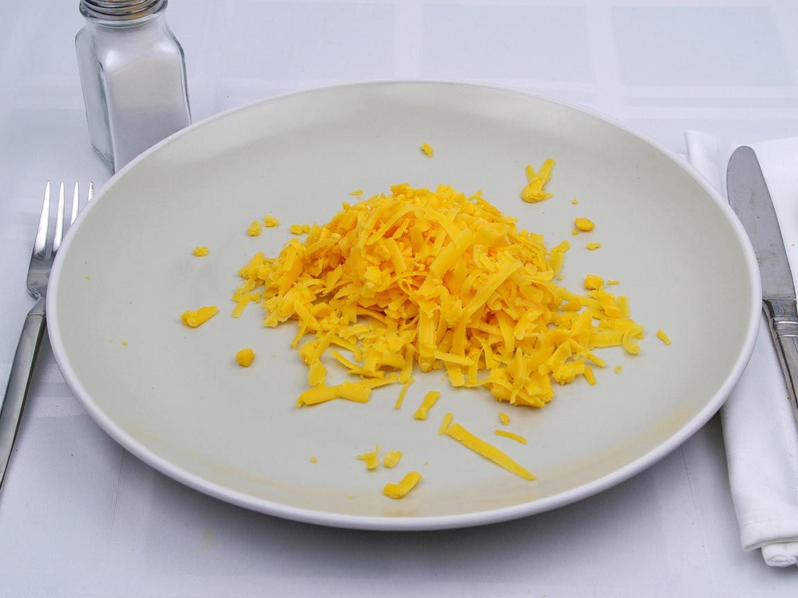 Calories in 0.75 cup(s) of Cheddar Cheese - Shredded
