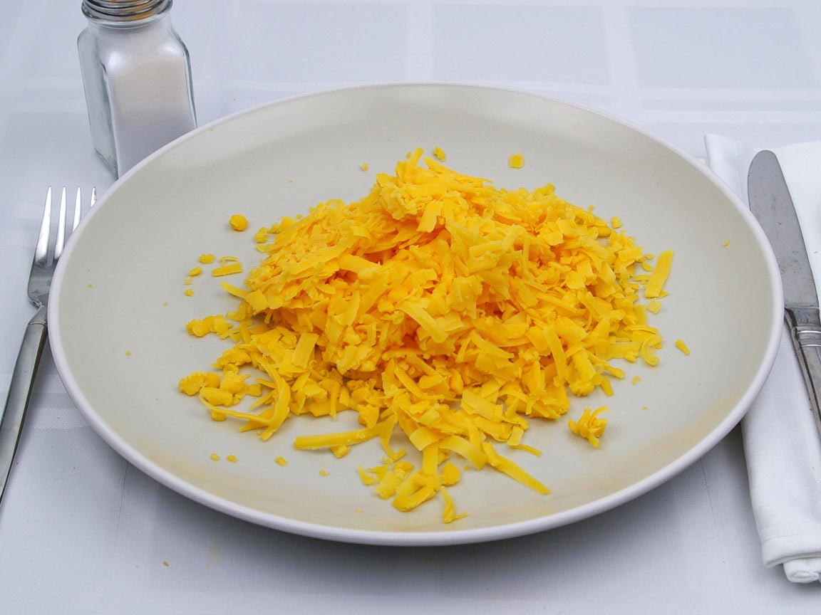 Calories in 1.75 cup(s) of Cheddar Cheese - Shredded