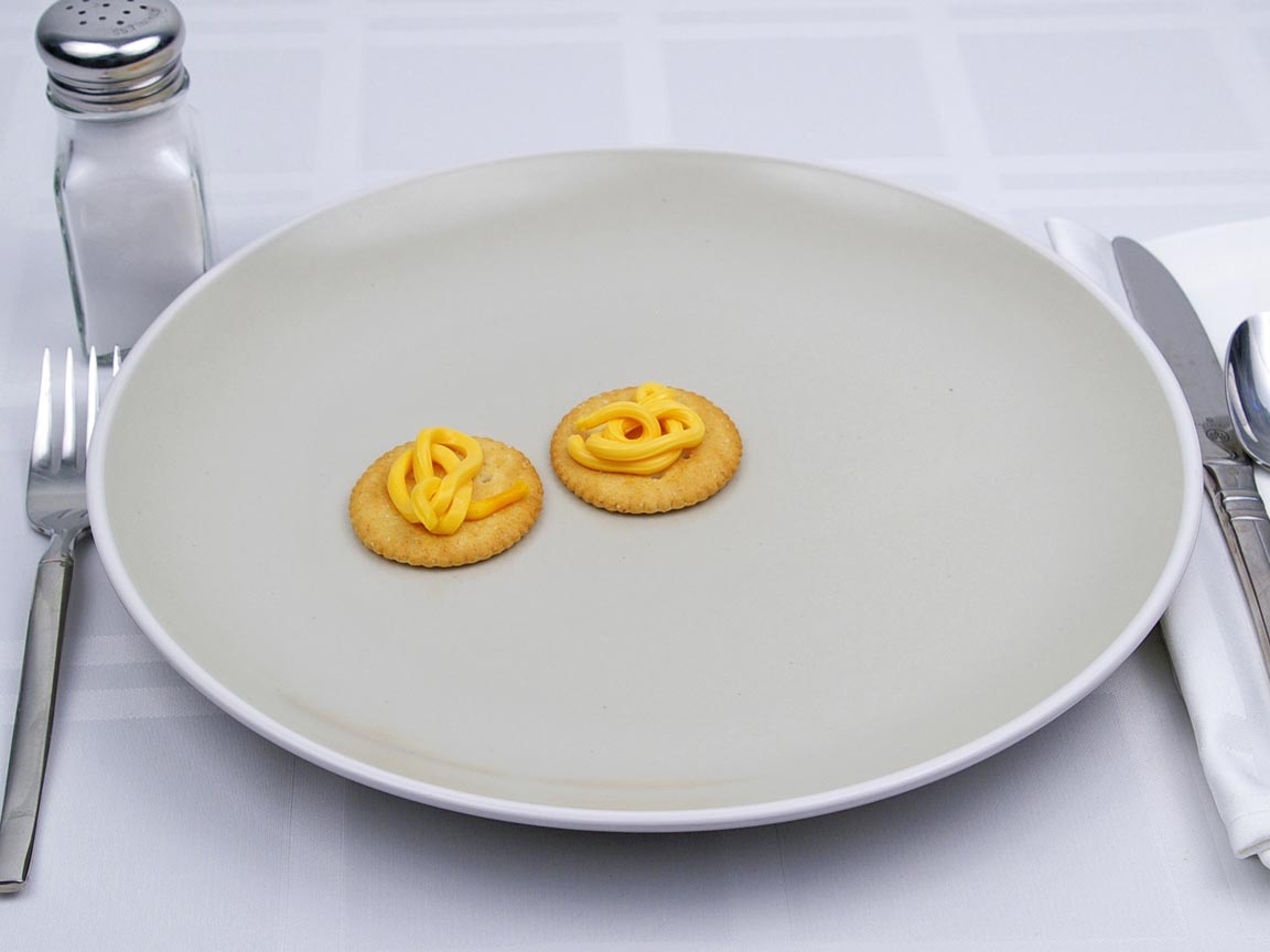 Calories in 2 tsp(s) of Easy Cheese - Shown on Cracker