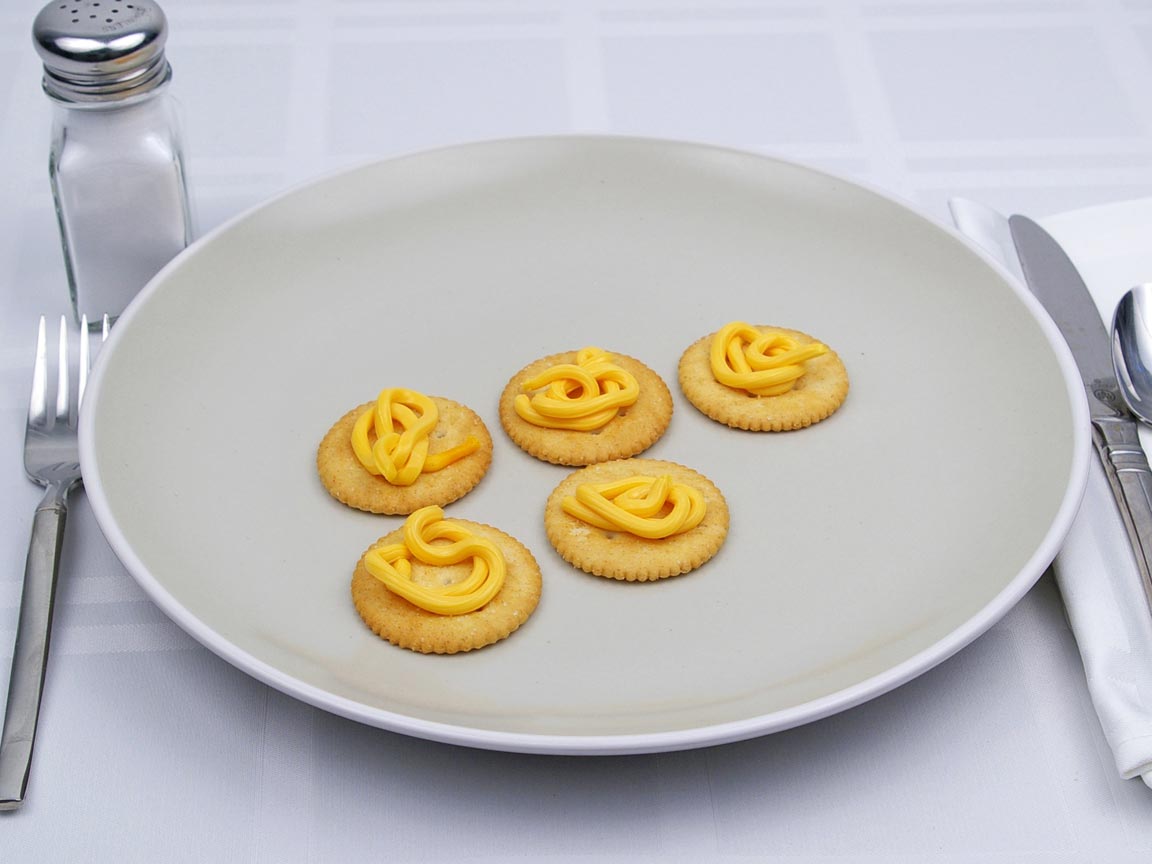 Calories in 5 tsp(s) of Easy Cheese - Shown on Cracker