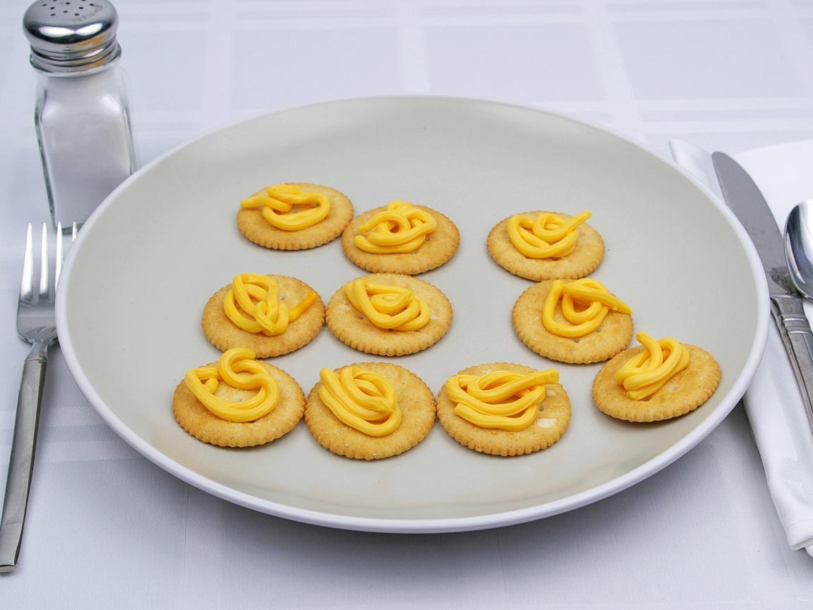Calories in 10 tsp(s) of Easy Cheese - Shown on Cracker