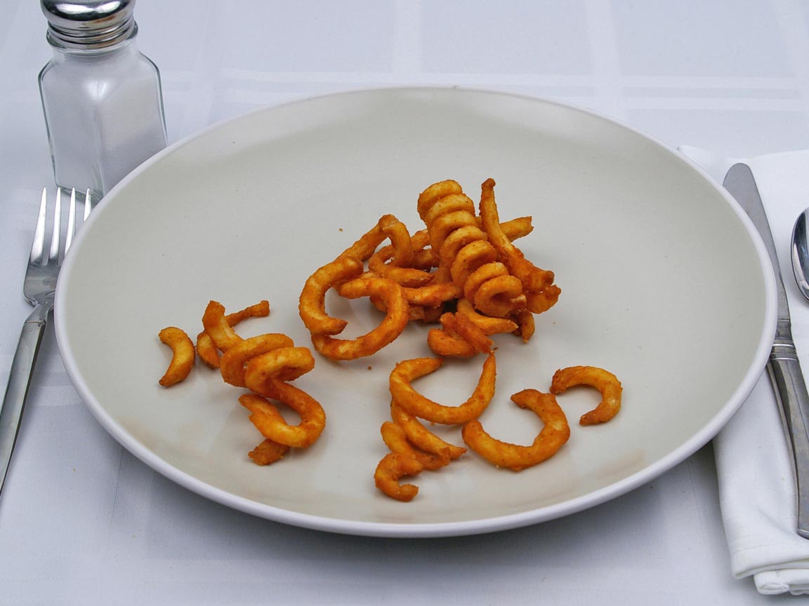 Calories in 0.25 large of Jack in the Box - Seasoned Curly Fries