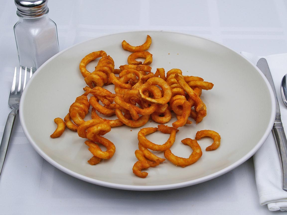 Calories in 0.5 large of Jack in the Box - Seasoned Curly Fries
