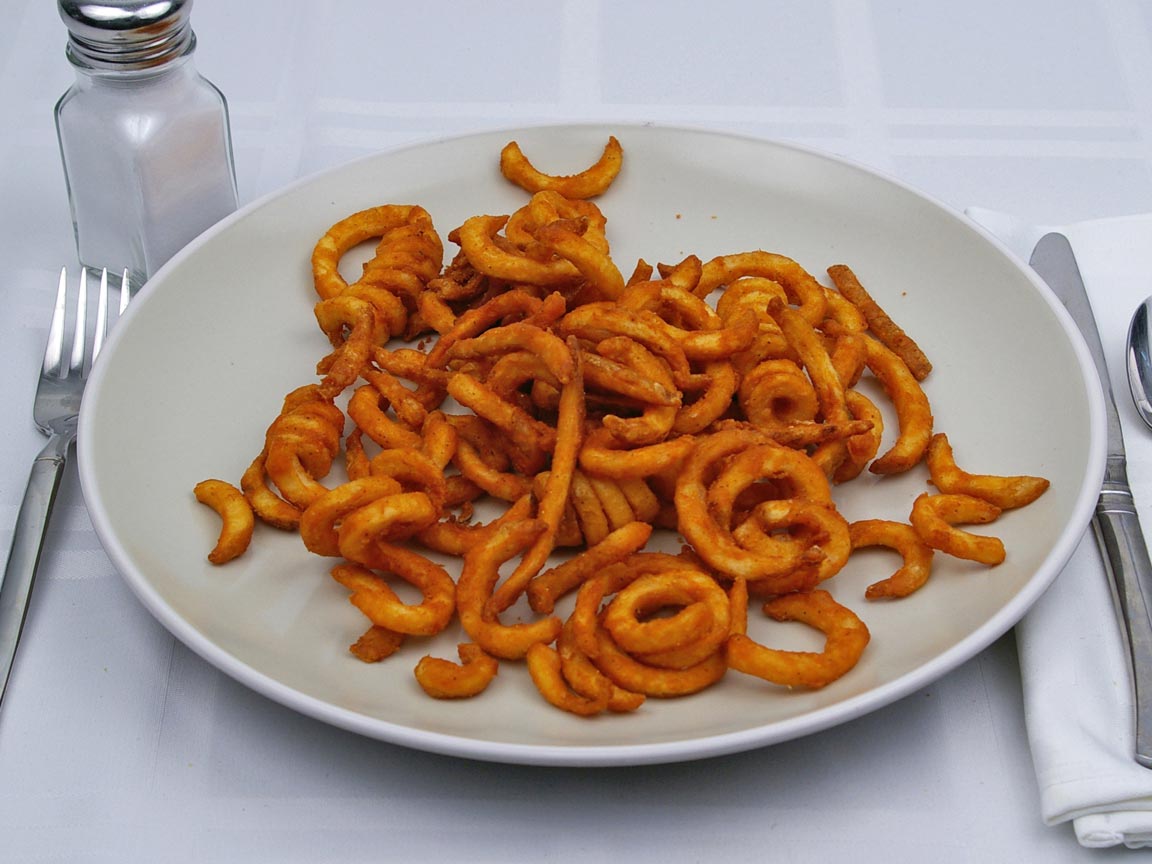 Calories in 1 large of Jack in the Box - Seasoned Curly Fries