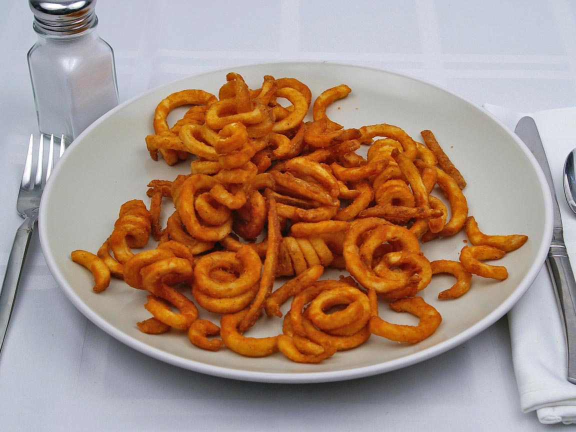 Calories in 1.25 large of Jack in the Box - Seasoned Curly Fries