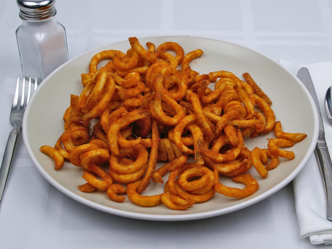 Calories in 1.75 large of Jack in the Box - Seasoned Curly Fries