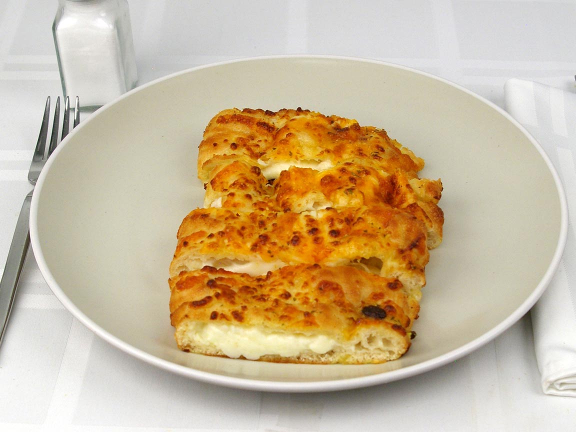 Calories in 4 piece(s) of Domino's Stuffed Cheesy Bread