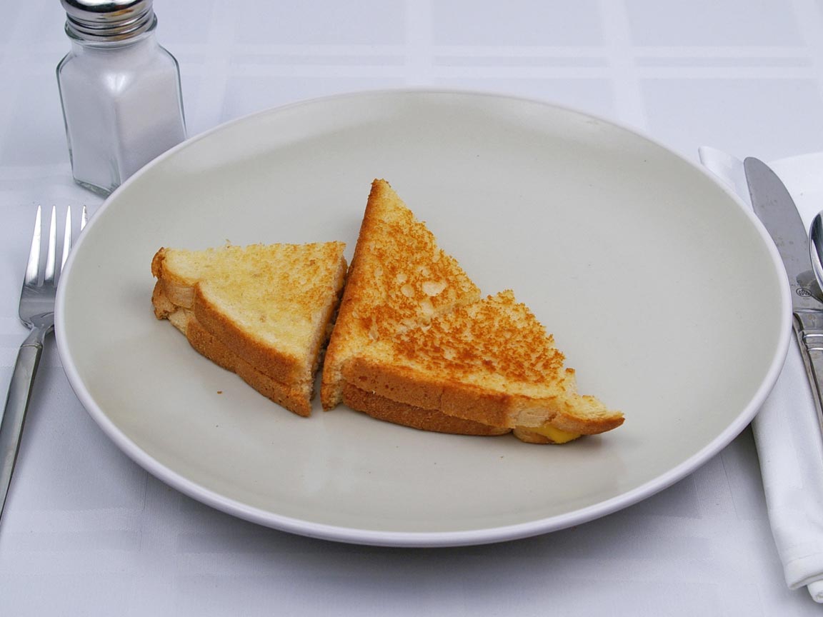 Calories in 0.75 sandwhich(s) of Grilled Cheese -2 Slices American Cheese - 1 tbsp Butter