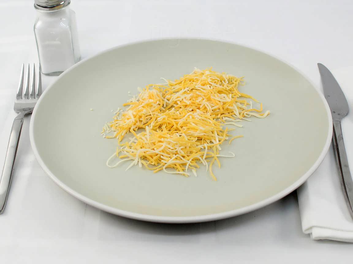 Calories in 25 grams of Shredded Cheddar Jack Cheese