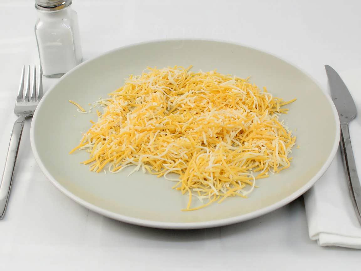 Calories in 60 grams of Shredded Cheddar Jack Cheese