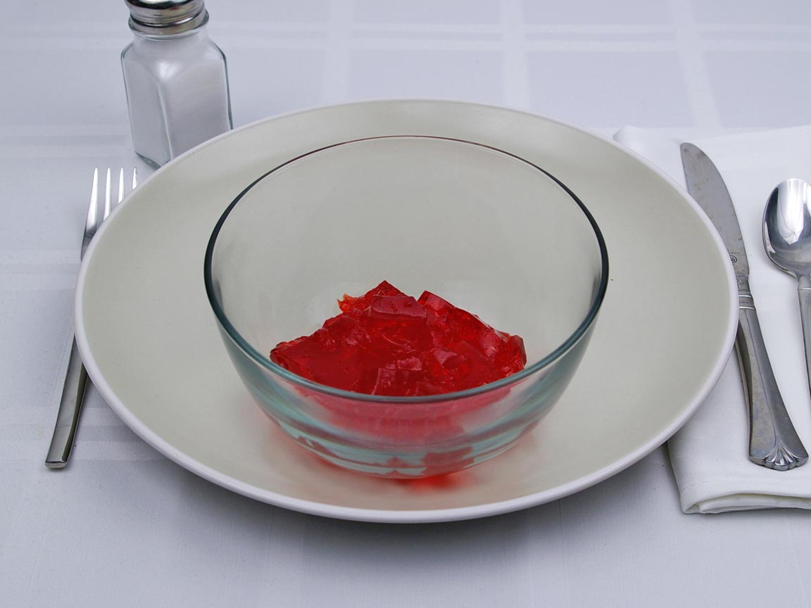 Calories in 0.5 cup(s)  of Jello - Gelatin