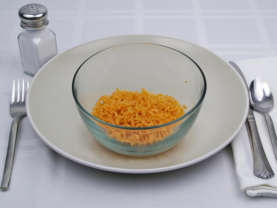 Calories in 0.5 cup(s) of Mexican Rice