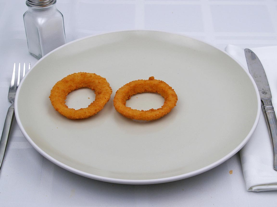 Calories in 0.25 serving(s) of Carl's Jr - Onion Rings