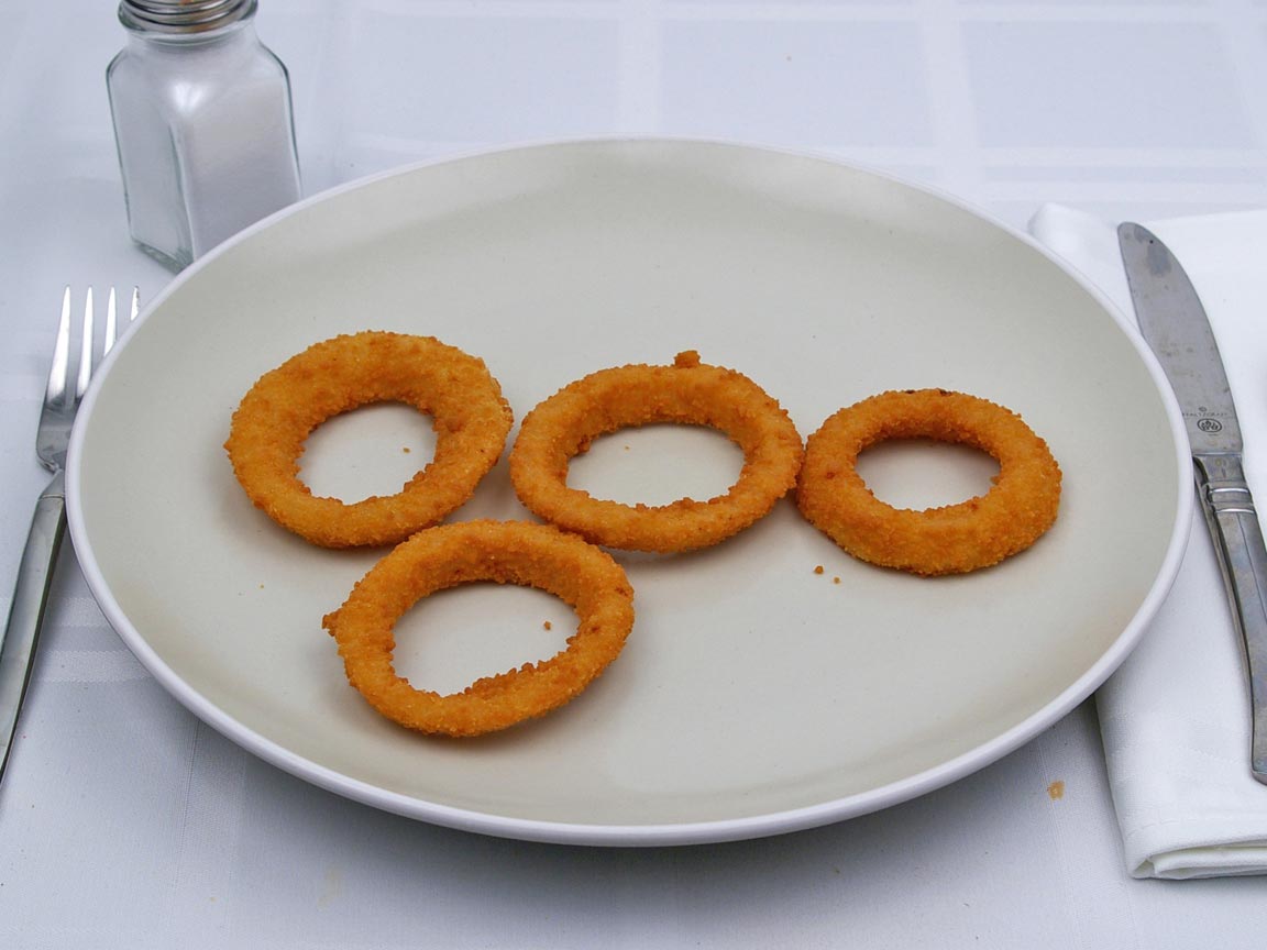 Calories in 0.5 serving(s) of Carl's Jr - Onion Rings