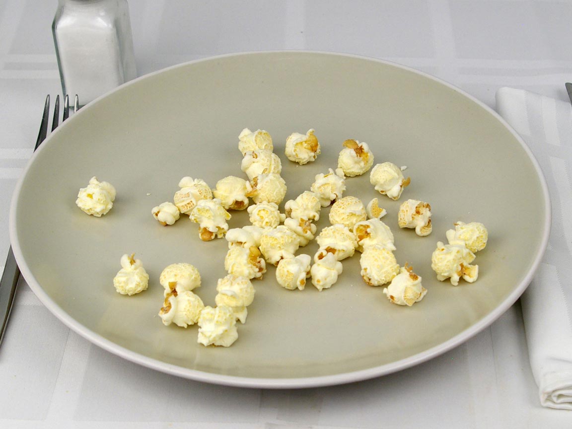 Calories in 7 grams of Popcornopolis White Cheddar Popcorn