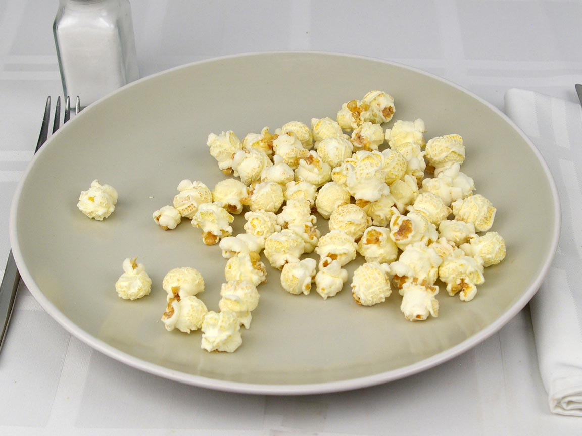 Calories in 14 grams of Popcornopolis White Cheddar Popcorn