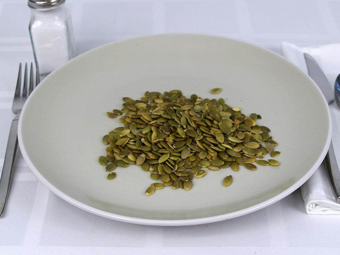 Calories in 0.5 cup(s) of Pumpkin Seeds Shelled