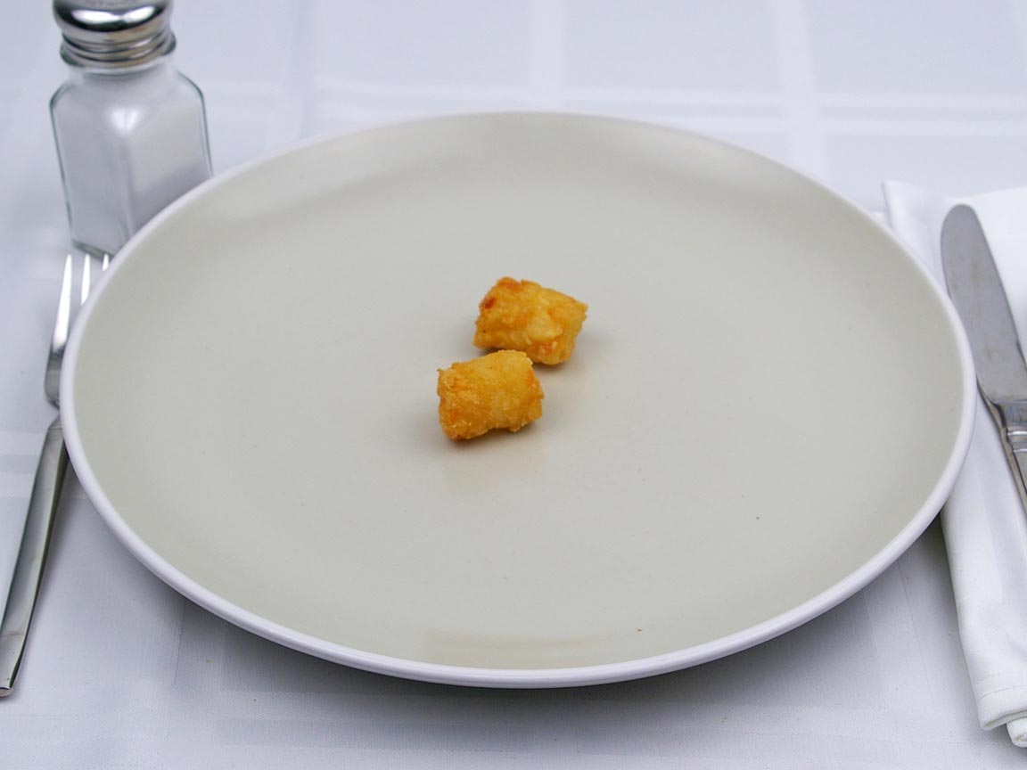 Calories in 17 grams of Tater Tots -Frozen Oven Heated