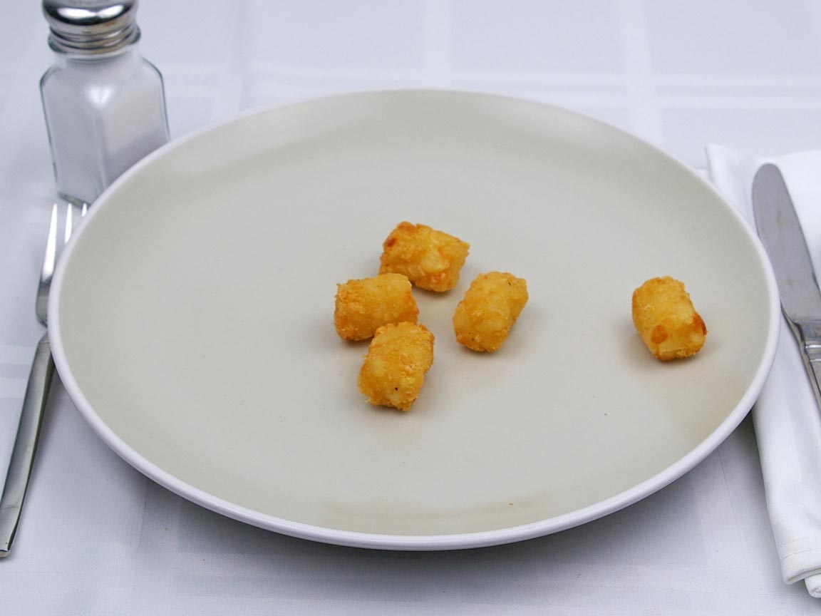 Calories in 42 grams of Tater Tots -Frozen Oven Heated