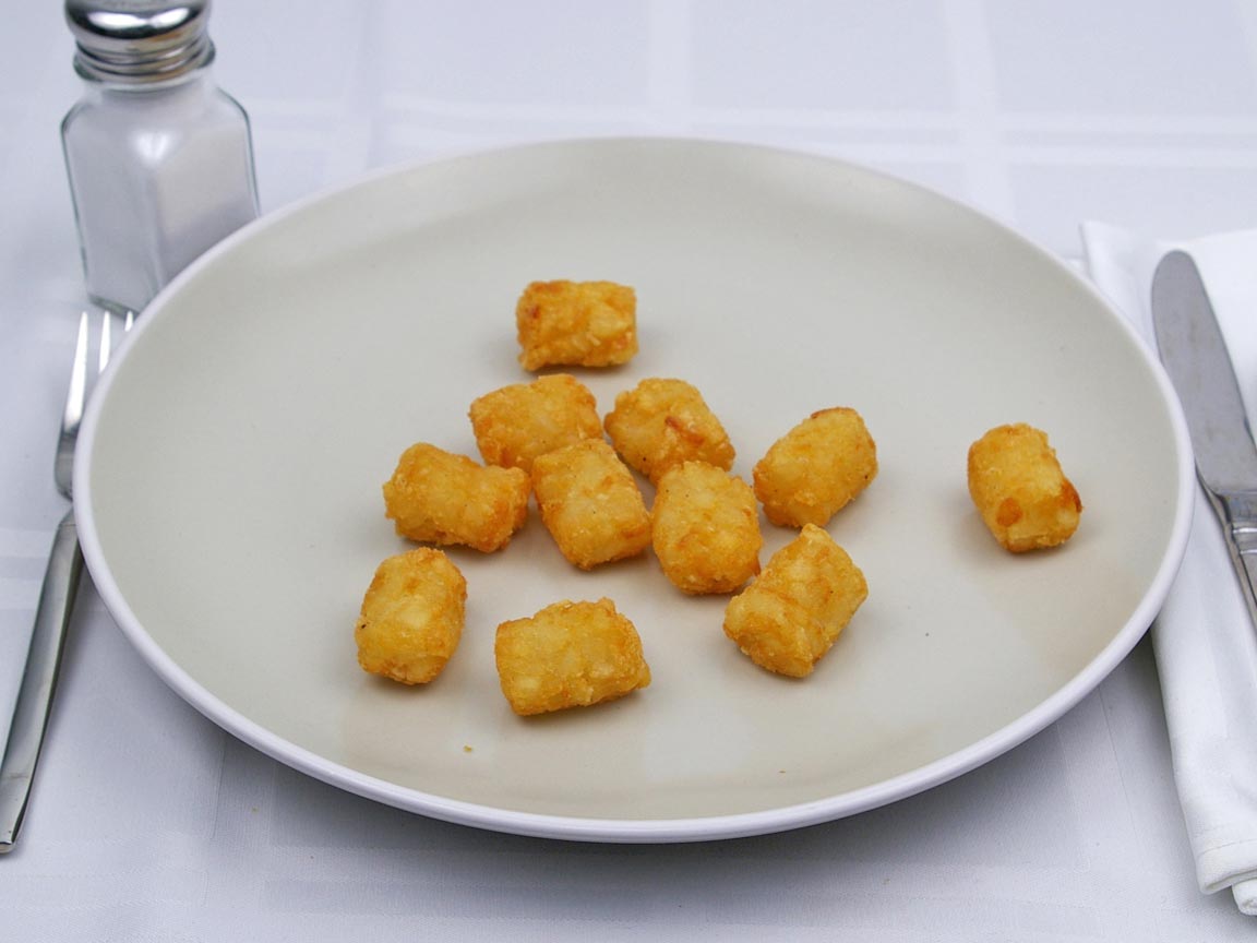 Calories in 93 grams of Tater Tots -Frozen Oven Heated