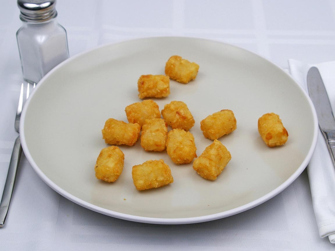 Calories in 102 grams of Tater Tots -Frozen Oven Heated