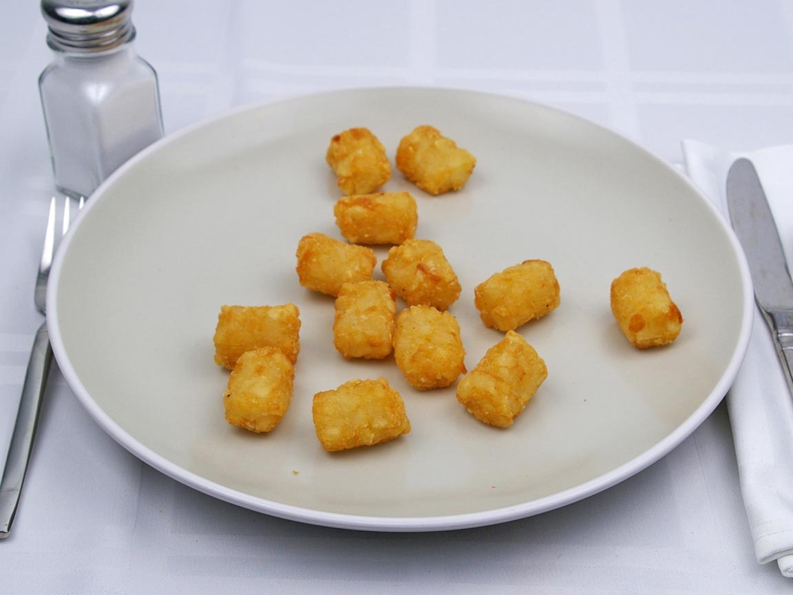 Calories in 110 grams of Tater Tots -Frozen Oven Heated