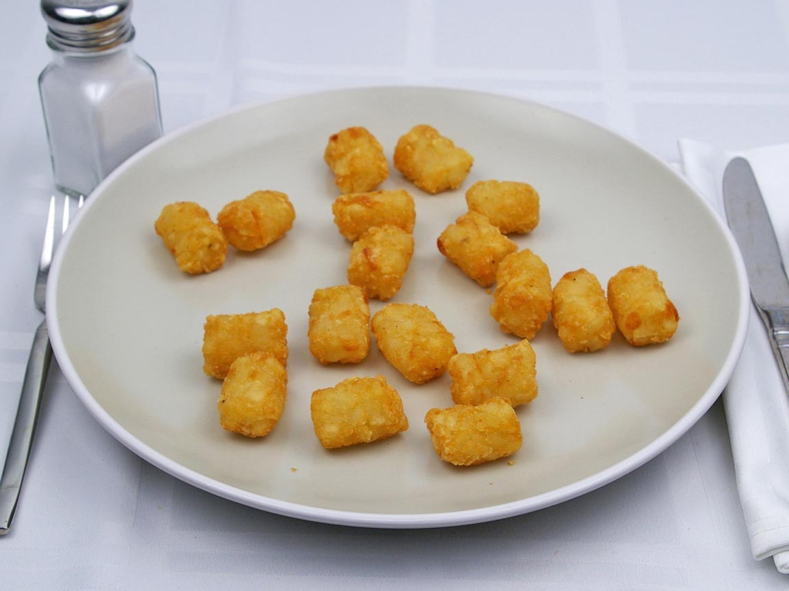 Calories in 153 grams of Tater Tots -Frozen Oven Heated