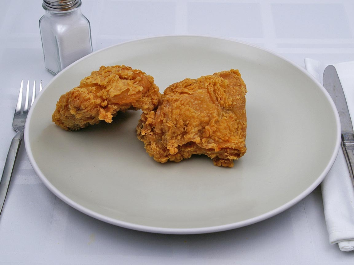 Calories in 2 thigh(s) of Kentucky Fried Chicken - Thigh - Extra Crispy