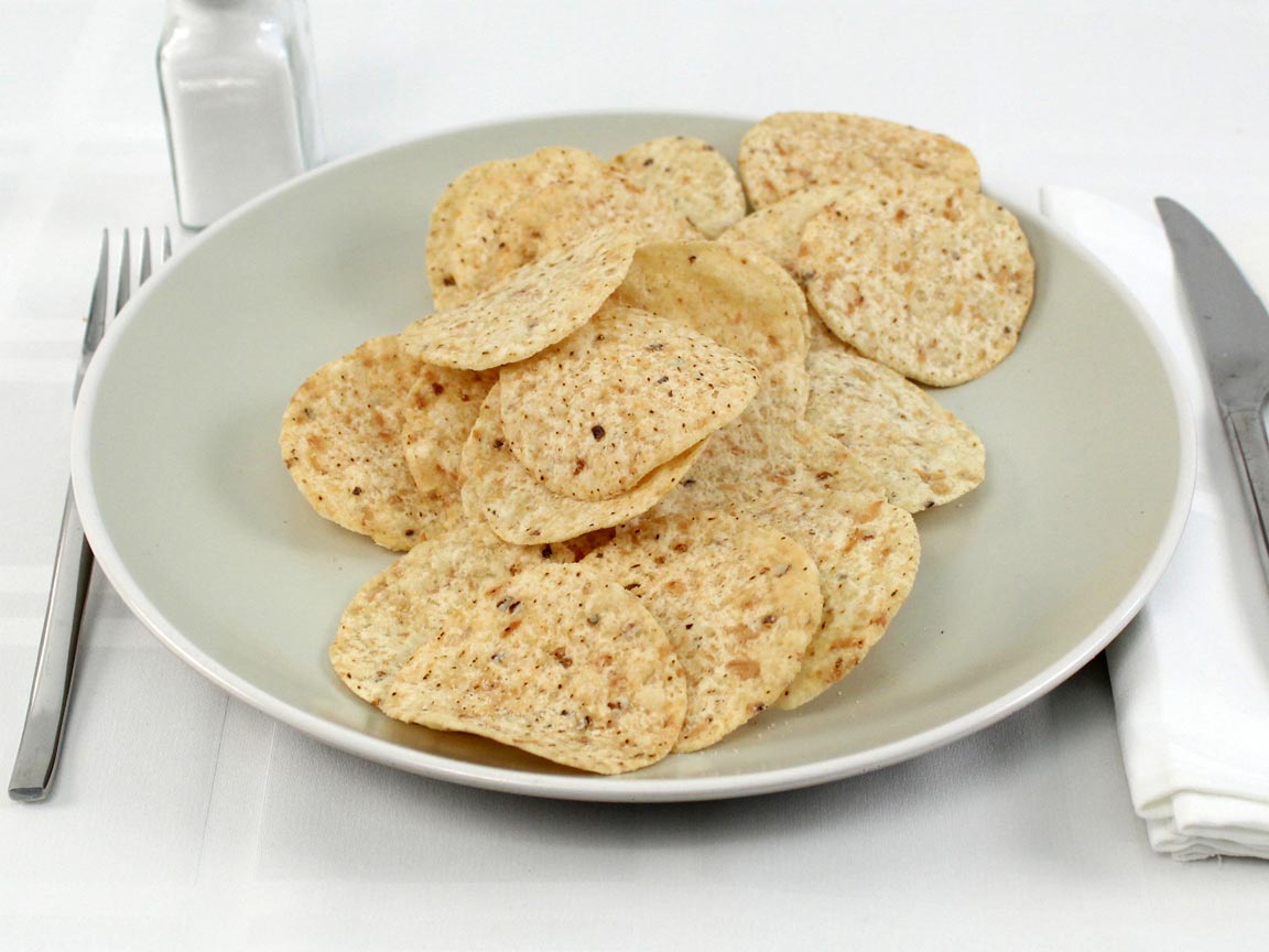 Calories in 85 grams of Tortilla Chips Rounds