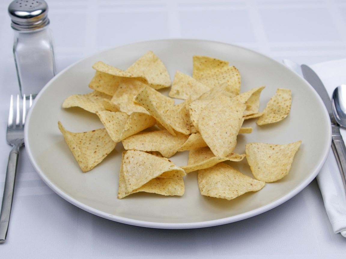 Calories in 49 grams of White Corn Tortilla Chips