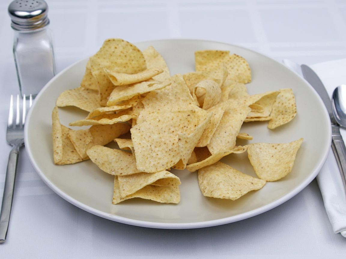 Calories in 85 grams of White Corn Tortilla Chips